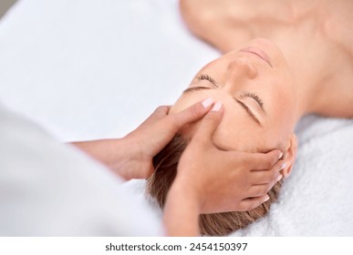 Woman, hands and facial massage or masseuse for treatment, cosmetics and beauty therapy. Female person, relax and serene or dermatology, skin care detox and rest at spa for peace or zen and calm - Powered by Shutterstock