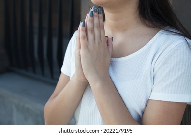 Woman hands folded in prayer. Woman is praying at the church. - Shutterstock ID 2022179195