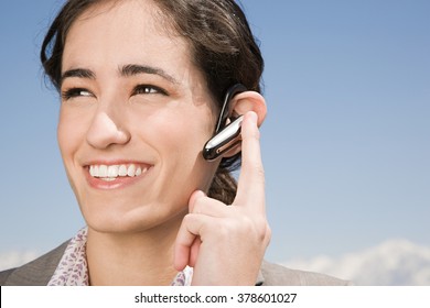 Woman with hands free device - Powered by Shutterstock