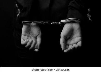 Woman Hands In Handcuffs (close-up)