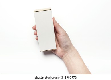 A Woman Hands Hold A Empty(blank, Vacant, Hollow) White Paper Box(package) For Cosmetics, Accessory, Top View Isolated White At The Studio.