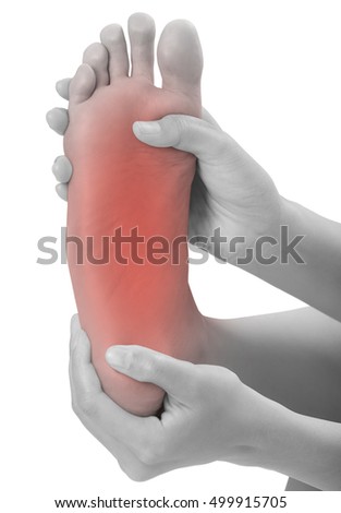 woman hands holding  beautiful healthy foot and massaging in pain area, black and white color with red highlighted, Pained body Concept, isolated on white background.