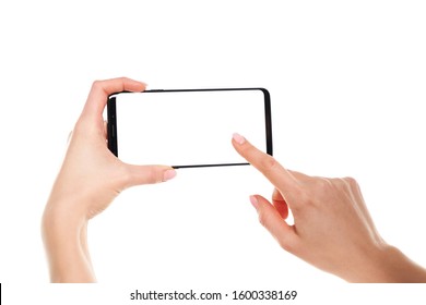 Woman Hands Holding The Black Smartphone Blank Screen With Modern Frameless Design Isolated On White Background