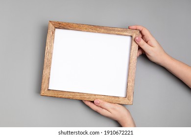 Woman Hands Holding Blank Wooden Frame . Mockup, Template, Copy Space