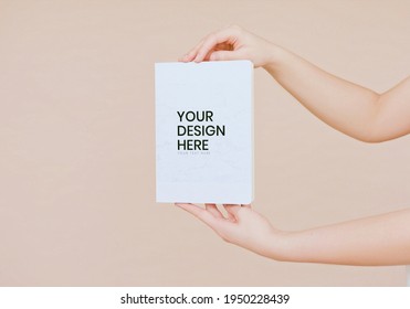 A Woman Hands Holding A Book Mockup