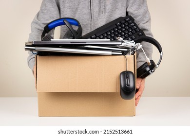 Woman hands holding cardboard box full old used computers, phones, tablets, gadget devices for recycling. Planned obsolescence, e-waste, donation, electronic waste for reuse and recycle concept - Shutterstock ID 2152513661
