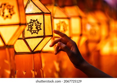woman hands holding Colorful paper Lantern in lanna Yee Peng Festival (North of Thailand new years)