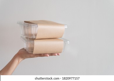 Woman Hands Holding Empty Plastic Disposable Food Container Mock Up With Copy Space. Delivery Food Concept.