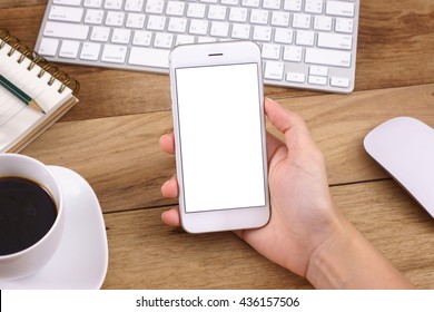 woman hands holding empty screen of smartphone on wood desk work.
