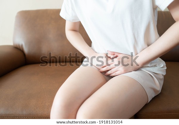 Woman hands holding her crotch suffering from pain\
or itchy. Gynecological problems include menstrual disorders,\
urinary incontinence, genital tract infections, pelvic pain or\
ovarian cysts.