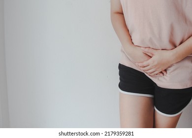 Woman Hands Holding Pressing Her Crotch Lower Abdomen, Abdominal Pain Of Young Woman, Gynecological Or Medical Problems Concept,