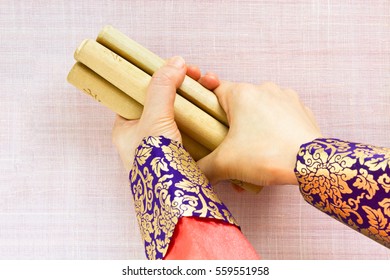 Woman Hands Holding Sticks 'Yut'. Yut Is Korean Traditional Game. 
