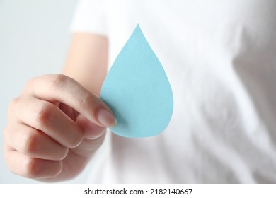 Woman Hands Holding Water Drop On White Background, World Water Day,clean Water Sanitation, Save Water, World Oceans Day Concept.