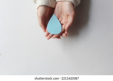 Woman Hands Holding Water Drop On White Background, World Water Day,clean Water Sanitation, Save Water, World Oceans Day Concept.