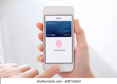 Woman Hands Holding White Phone With Debit Card App Touch And Pay On Screen