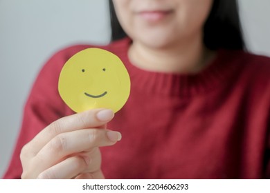 Woman Hands Holding Yellow Smile Face Paper, Good Feedback Rating,think Positive, Customer Review, Assessment, World Mental Health Day, Compliment Day.