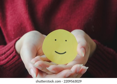 Woman Hands Holding Yellow Smile Face Paper, Good Feedback Rating,think Positive, Customer Review, Assessment, World Mental Health Day, Compliment Day.