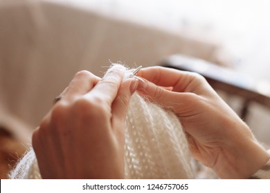 The woman hands knit natural woolen clothes. Knitting needles close-up. Horizontal photo. Freelance creative working. Handcraft concept - Shutterstock ID 1246757065