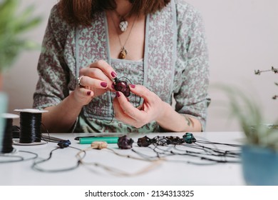 Woman hands making handmade gemstone jewellery, home workshop. Women artisan creates jewellery. Art, hobby, handcraft concept - Powered by Shutterstock