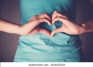 Woman Hands Making A Heart Shape On Her Stomach, Healthy Bowel Degestion, Probiotics And Prebotics  For Gut Health, Organ Donor Day