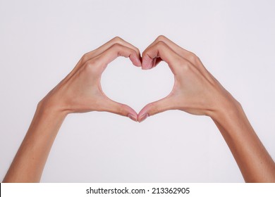 Woman Hands Making A Heart Shape On A White Isolated Background