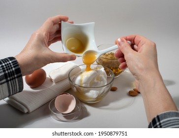 Woman Hands Making Homemade Cosmetics - Egg White Face Mask. Close Up.