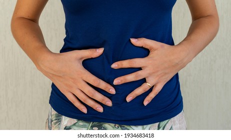 Woman With Hands On Belly, Probiotic And Prebiotic Foods For Intestinal Health, Having Stomach Pain, Leaky Gut, Women's Health, Menstrual Cramps. Menstrual Pain