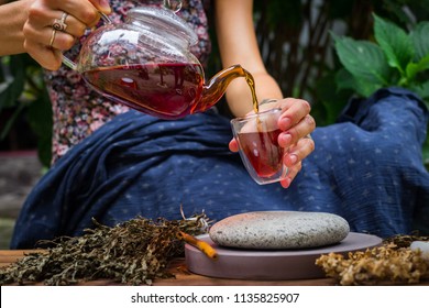 Woman Hands Pour Asian Tea. Japanese, Chinese And Thai Traditional Tea Ceremony With Pot And Small Cups. Herbal Green And Black Chinese Tea Leaves, Aromatic Drink, Authentic