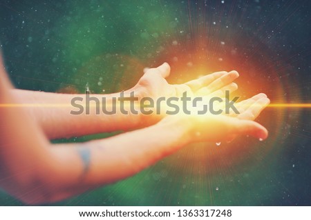 Woman hands praying for blessing from god, blurred nature background, rain, day. Religious human open empty hands with palms up. Gratitude, preacher worship, solitude pray, religion devotion concept