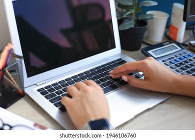 Woman Hands Pressing Keys On A Laptop Keyboard In Office