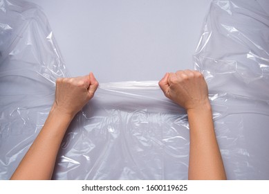 Woman Hands Pull Polyethylene Film