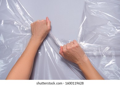 Woman Hands Pull Polyethylene Film