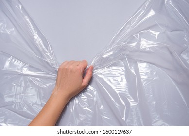 Woman Hands Pull Polyethylene Film