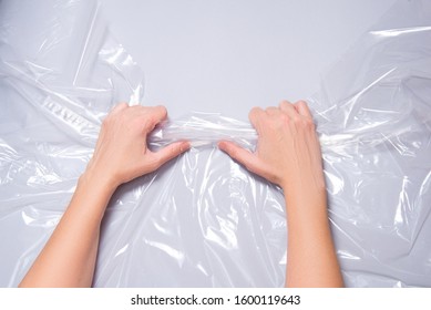 Woman Hands Pull Polyethylene Film