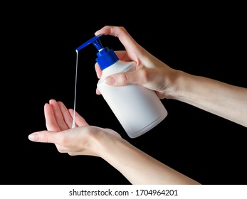 Woman Hands Pushing Soap Dispenser With Soap Drop. Isolated On Black, Clipping Path Included