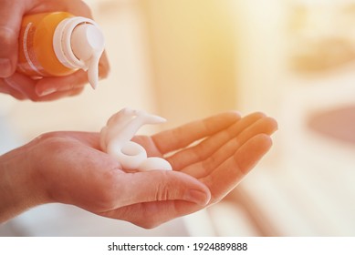 Woman Hands Putting Sunscreen From A Suncream Bottle