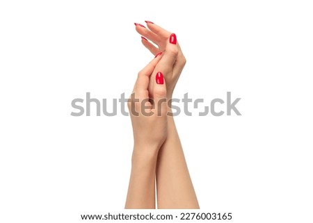 Woman hands with red nails isolated on a white background. Red nail polish. 