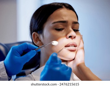 Woman, hands and scared for dental surgery in clinic with fear for teeth removal and treatment with doctor. Female person, dentist and worry or nervous in consultation with canal procedure for health - Powered by Shutterstock