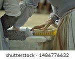 Woman hands. Two ladies doing the laundry how the old school used to do it. Different way. No machines, no electricity. Brush and hands. Strong hands.