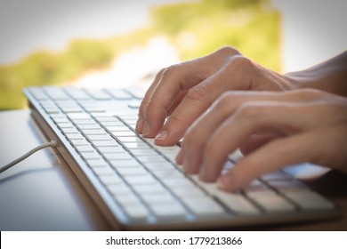 Woman hands typing on a keyboard - Shutterstock ID 1779213866