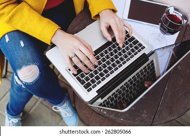 Woman Hands Typing On Laptop, Tablet And Red Wine Outdoors In Cafe