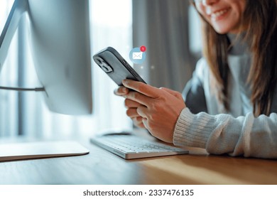 Woman hands using smartphone with 1 new email alert sign icon pop up, Female using phone for check email for work or sending text SMS short message at home, Online communication concept
