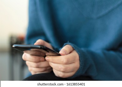 Woman hands using smartphone. Close-up
