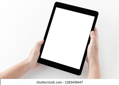 Woman hands using tablet computer and blank white screen on table with clipping path.
