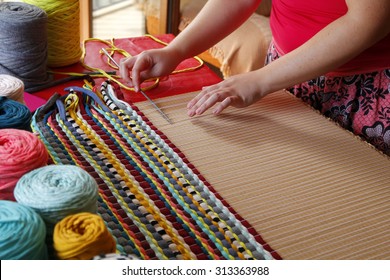 Woman Hands Weaving A Handmade Carpet