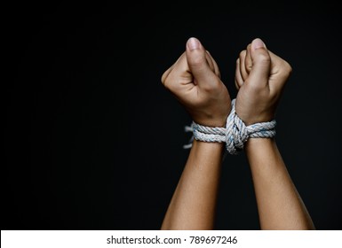 Woman hands were tied with a rope. Violence, Terrified, Human Rights Day concept. - Shutterstock ID 789697246