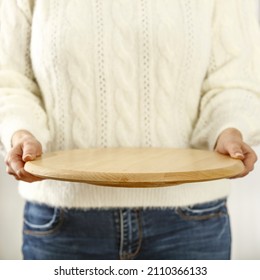 Woman hands and wooden tray background of free space for your decoration. 