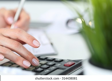 Woman Hands Working On Calculator Close Up