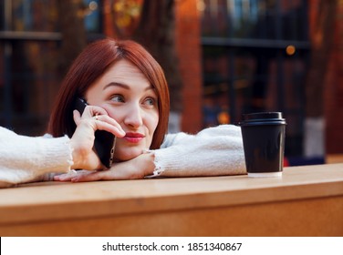 Woman Hanging On A Phone With Raised Brows Expression On Her Face. Chatting With Friends Concept. Digital Communication. Female With Sceptic Face Talking On Smartphone