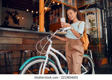 Woman, happy and bike with phone at cafe on travel in city with bag. Black woman, smartphone and smile for communication, meme or social media on app with bicycle at coffee shop in San Francisco - Powered by Shutterstock